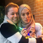 Finding Refuge in Friendship: Melanie and Houda on the front porch of KXCI.