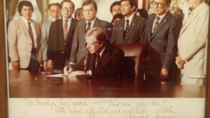 Photo of Jimmy Carter signing National Commission Bill, signed by HI Senator Inouye